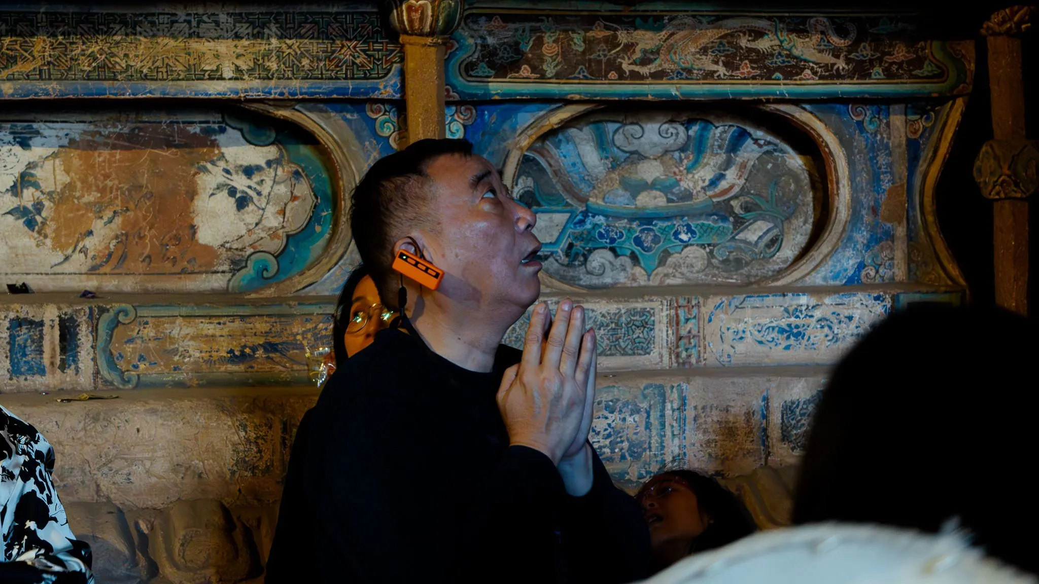 Praying in a cave