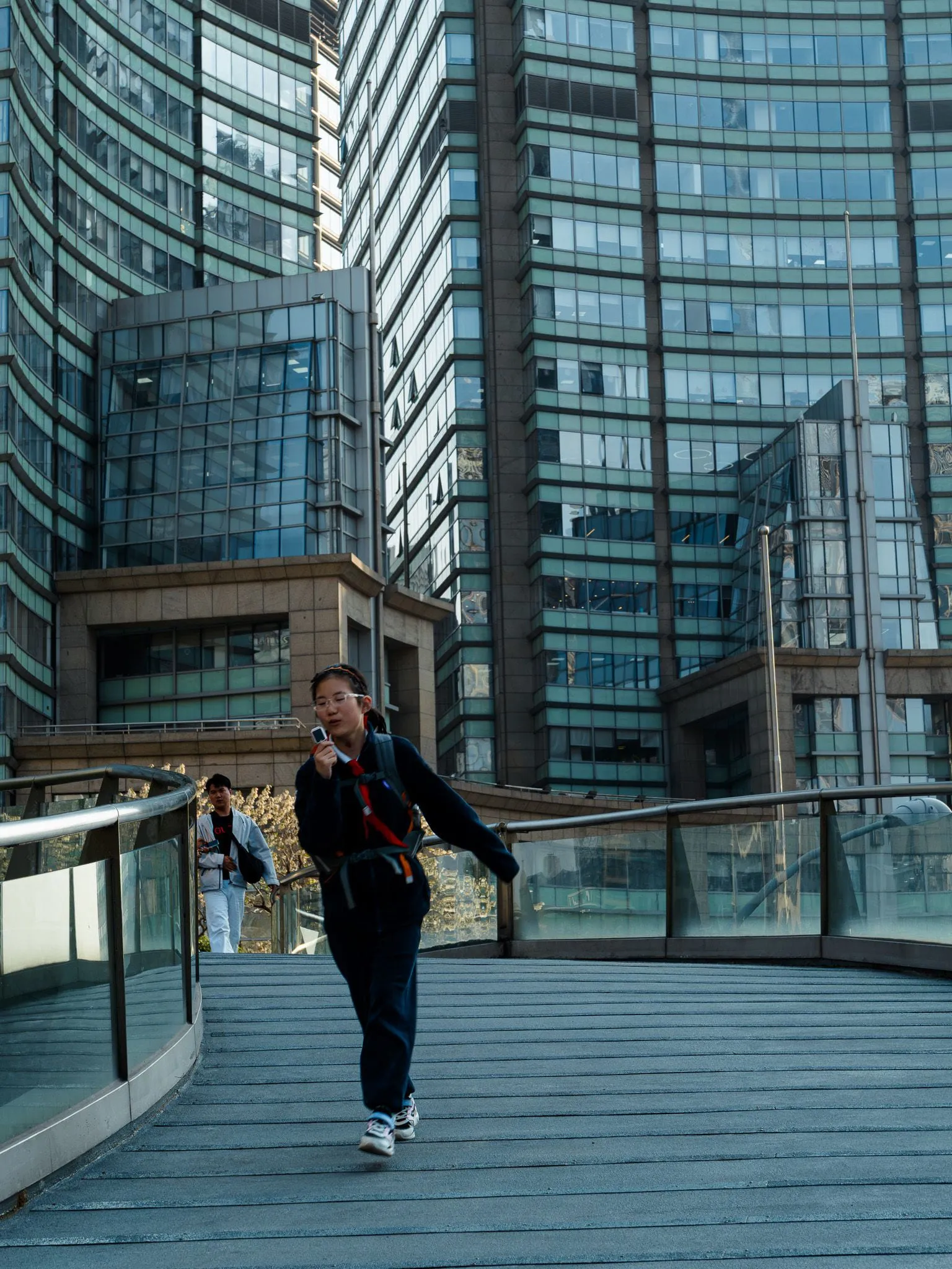 Kid between glass towers