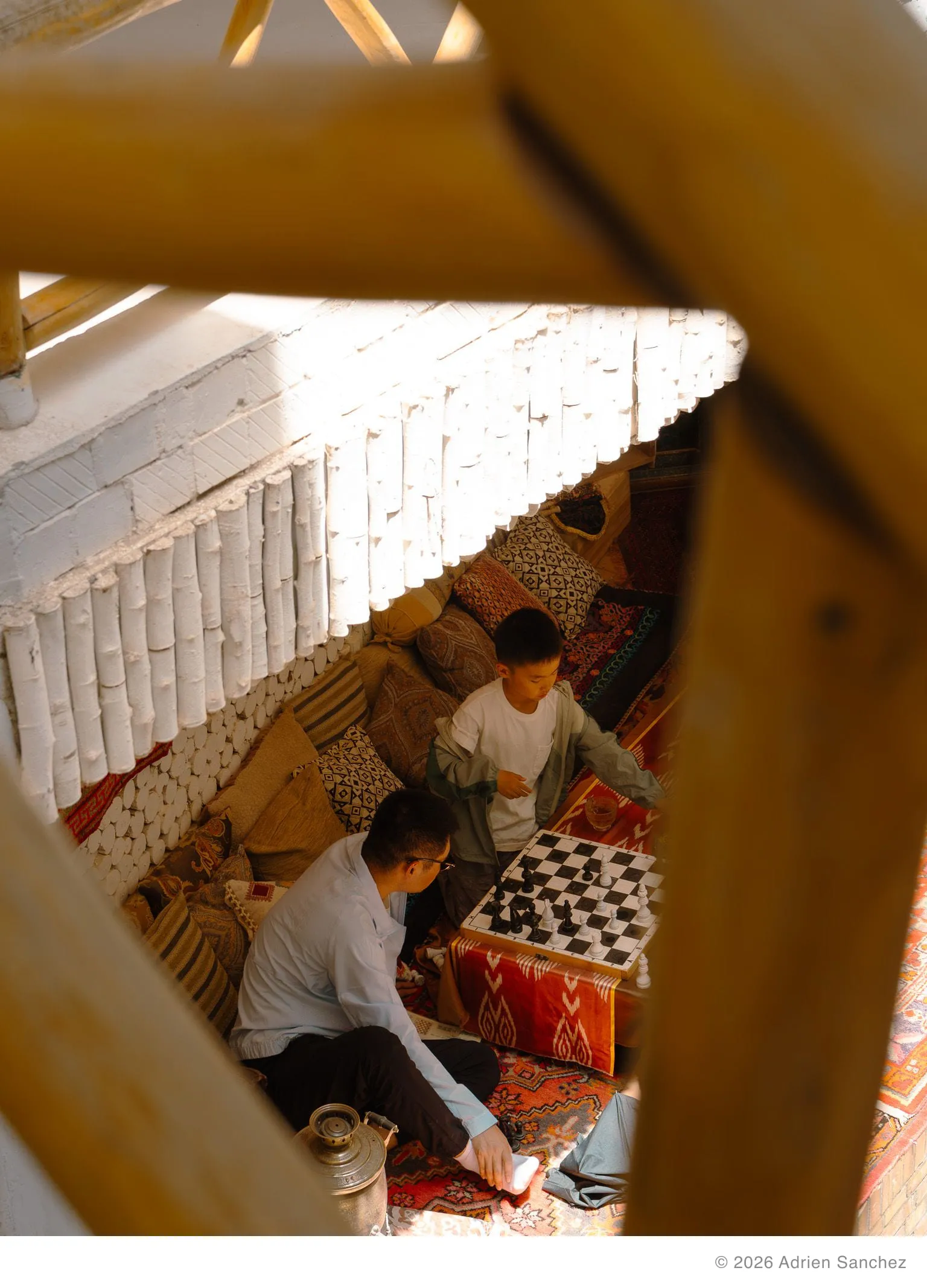 Father and son playing chess