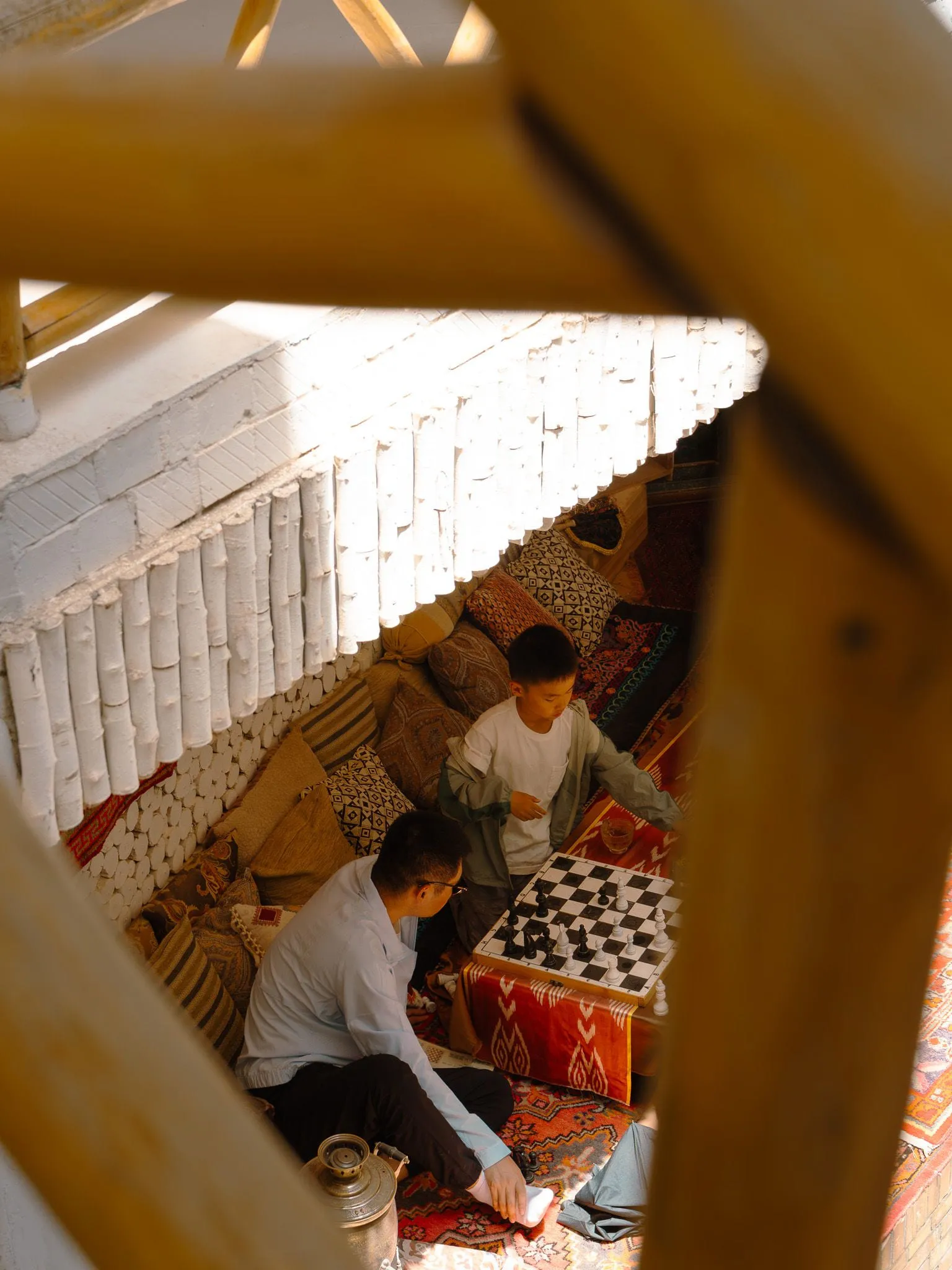 Father and son playing chess
