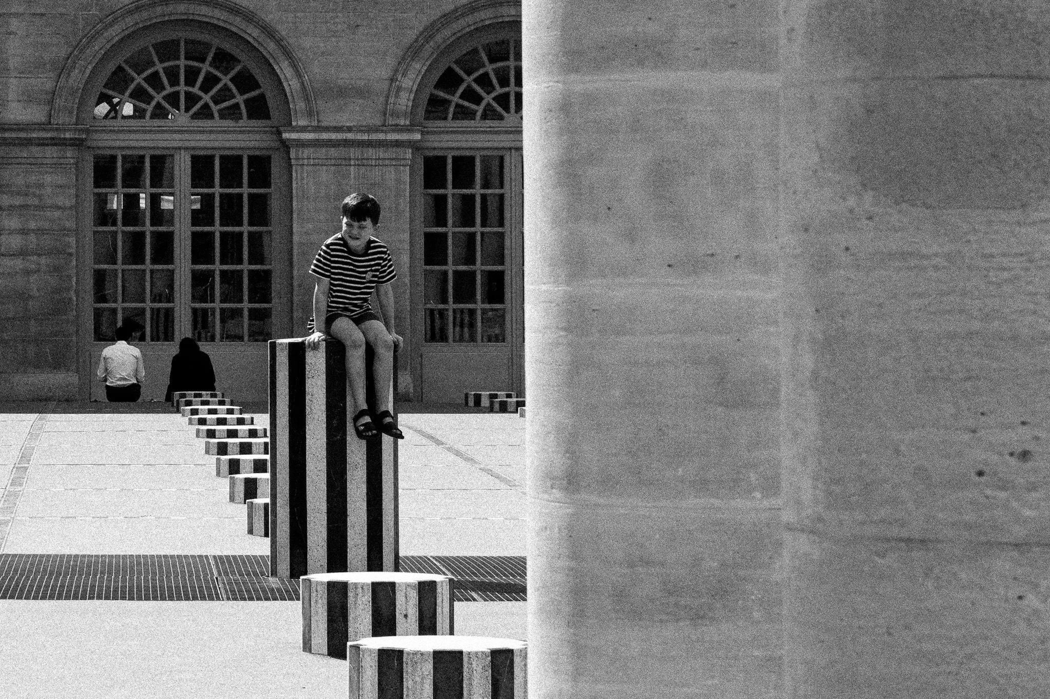 Boy on a striped column