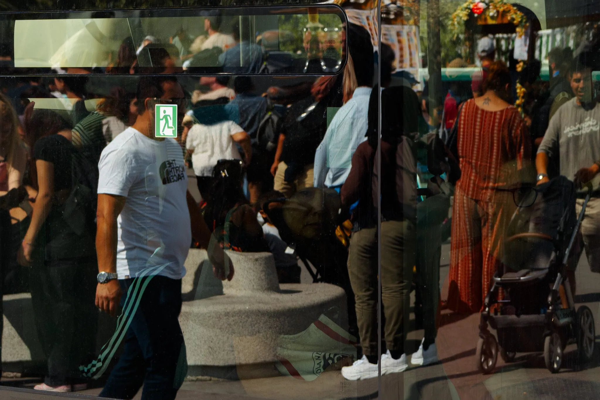 Crowd through the bus glass