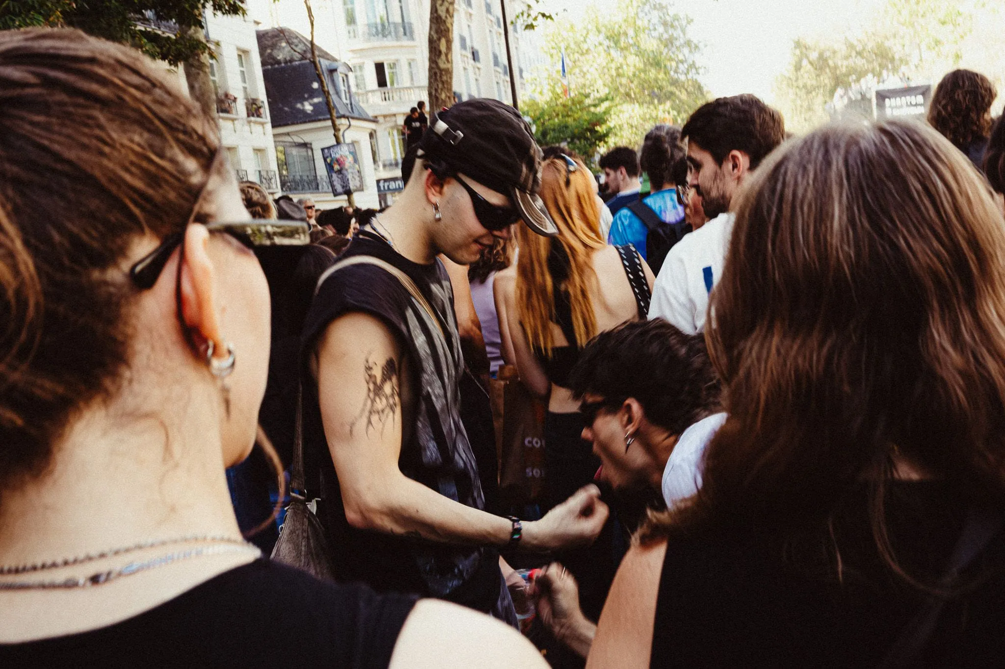 Tattooed arm in the crowd